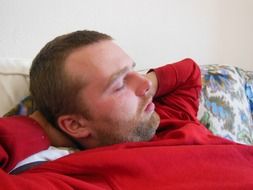 young man is sleeping