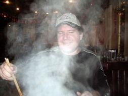 man and steam from food