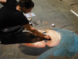 painting on ground created by chalk