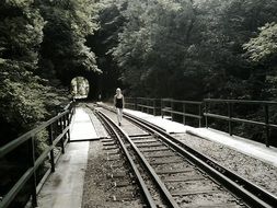 Walking girl on a rails