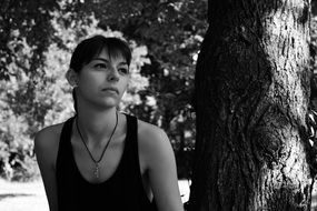 young girl near tree in park