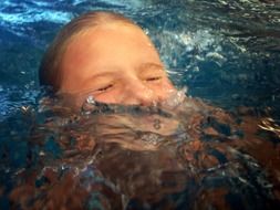 girl in the water in the pool