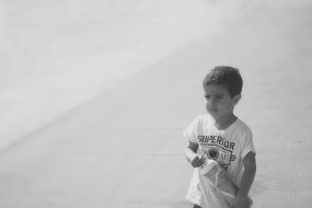 dark haired boy black and white recording
