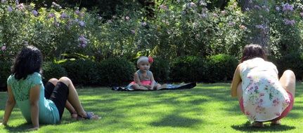 photo shoot of a child on a green lawn