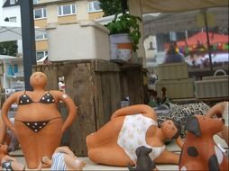figures of mermaids on the pottery market
