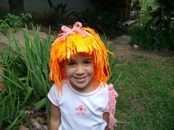 girl dressed in orange hair