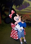minnie mouse, disney character, hugging child