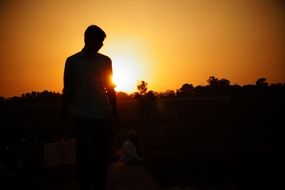 male silhouette at sunset