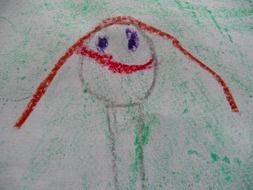 child's drawing of a smiling character