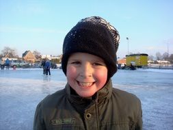 picture of the happy boy is ice skating