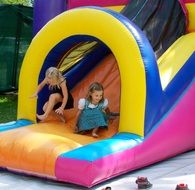 young children play on a trampoline