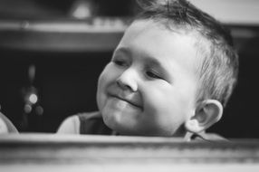 happy child sitting at the table