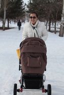 woman with brown stroller