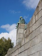bronze statue on a roof