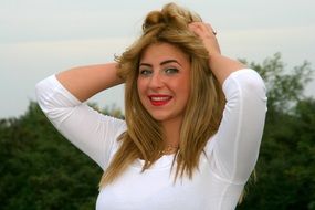 green-eyed blonde in white dress