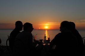 friends communicate at sunset