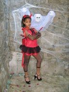 Ghost and Girl in the devil costume on Halloween