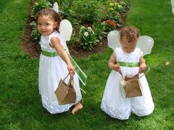 Girls in the angel costumes on the wedding