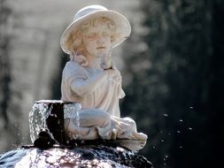 sculpture of a girl on the fountain