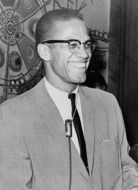 black and white photo of african american with microphone