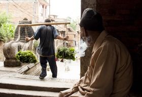 Old man is smoking