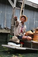 Selling hats on the floating market in thailand