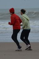 people running on the beach