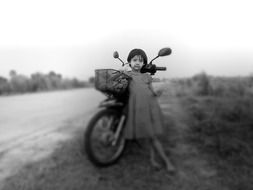 girl by the motorbike