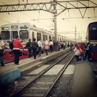 people on the railway platform in indonesia