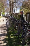 bicycles at the fence and people