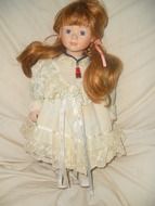 porcelain doll with golden hair