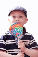 child with big lollypops