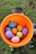 top view of easter eggs in orange bucket