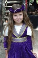 nice child girl in lilac renaissance costume