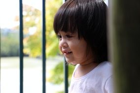 smiling baby in profile