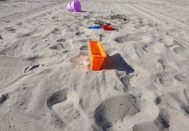 colorful toys in the sand on the beach