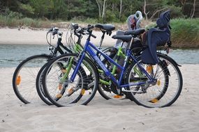 family bikes on the beach