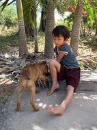 photo of the cute doggy and boy