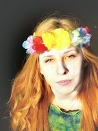 red-haired girl in a beautiful wreath