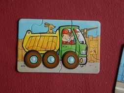 Colorful child puzzle with the truck