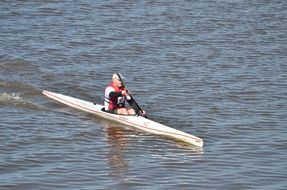 canoe on the water on a sunny day