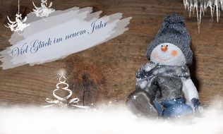 funny snowman in a hat on a card