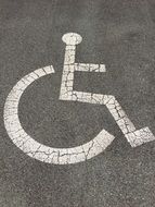 disabled sign on asphalt