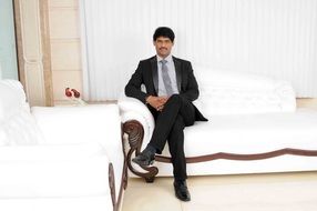 producer on a white sofa