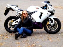 motorcycle girl in leather jacket sitting