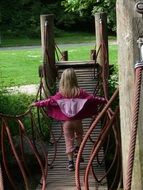 girl on the wooden bridge in the park