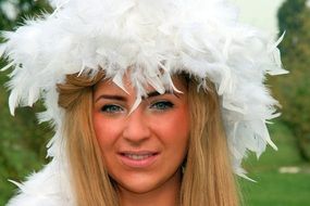 girl with white feathers on her head