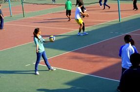 students play volleyball