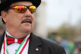 man in sunglasses at irish parade in Louisiana