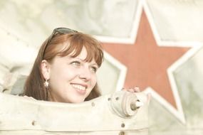 face of the Girl against the background of an airplane with a star